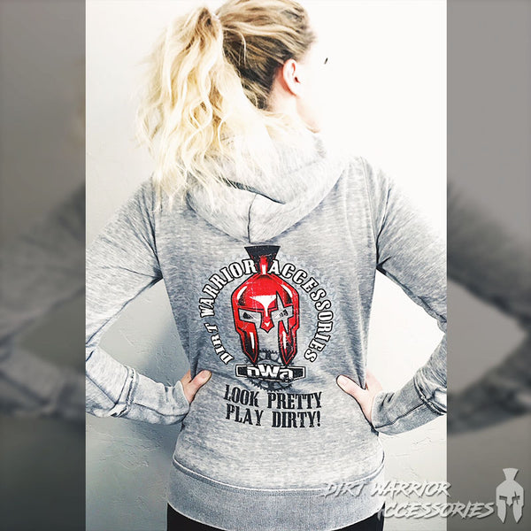 A female model wearing a gray J America ladies' zip-up hoodie with the hood down, Dirt Warrior Accessories logo on the back with Look Pretty Play Dirty